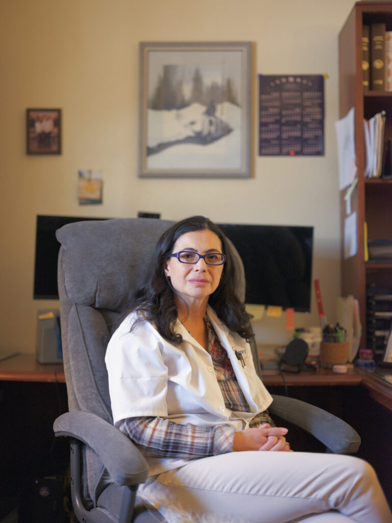 Julie Zahringer, owner and laboratory director of the Sangre de Cristo (SDC) Laboratory, in her office in Alamosa, Colorado. The SDC Laboratory, the only lab testing water in the San Luis Valley, serves private well owners, municipalities and agricultural water users. (Photo by Jacob Spetzler/Special to Inside Climate News)