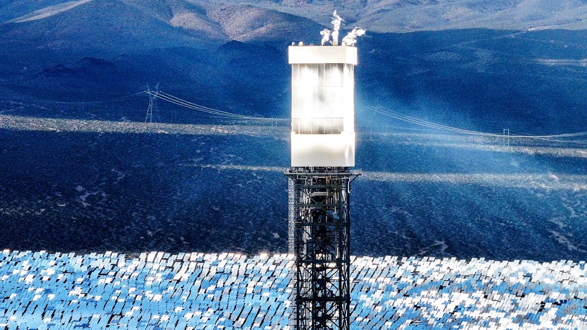 Ivanpah solar power tower surrounded by mirrors in California desert
