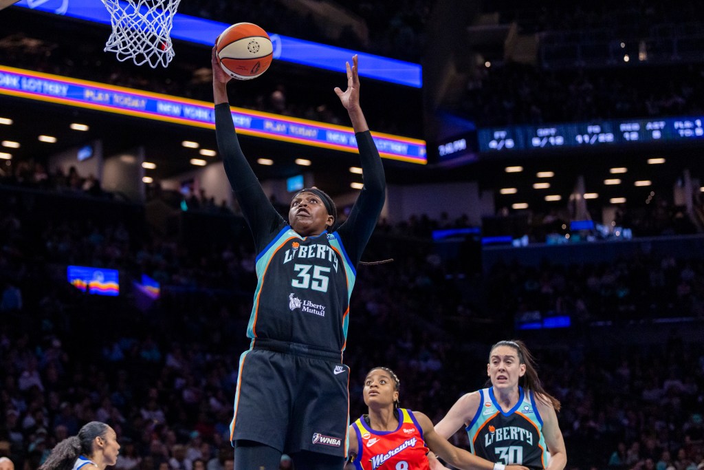 Jonquel Jones, who scored 17 points, grabs one of her 12 rebounds during the Liberty's win over the Mercury.