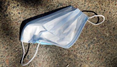 A mask is seen on a sidewalk in Boston Common on May 5, 2023.