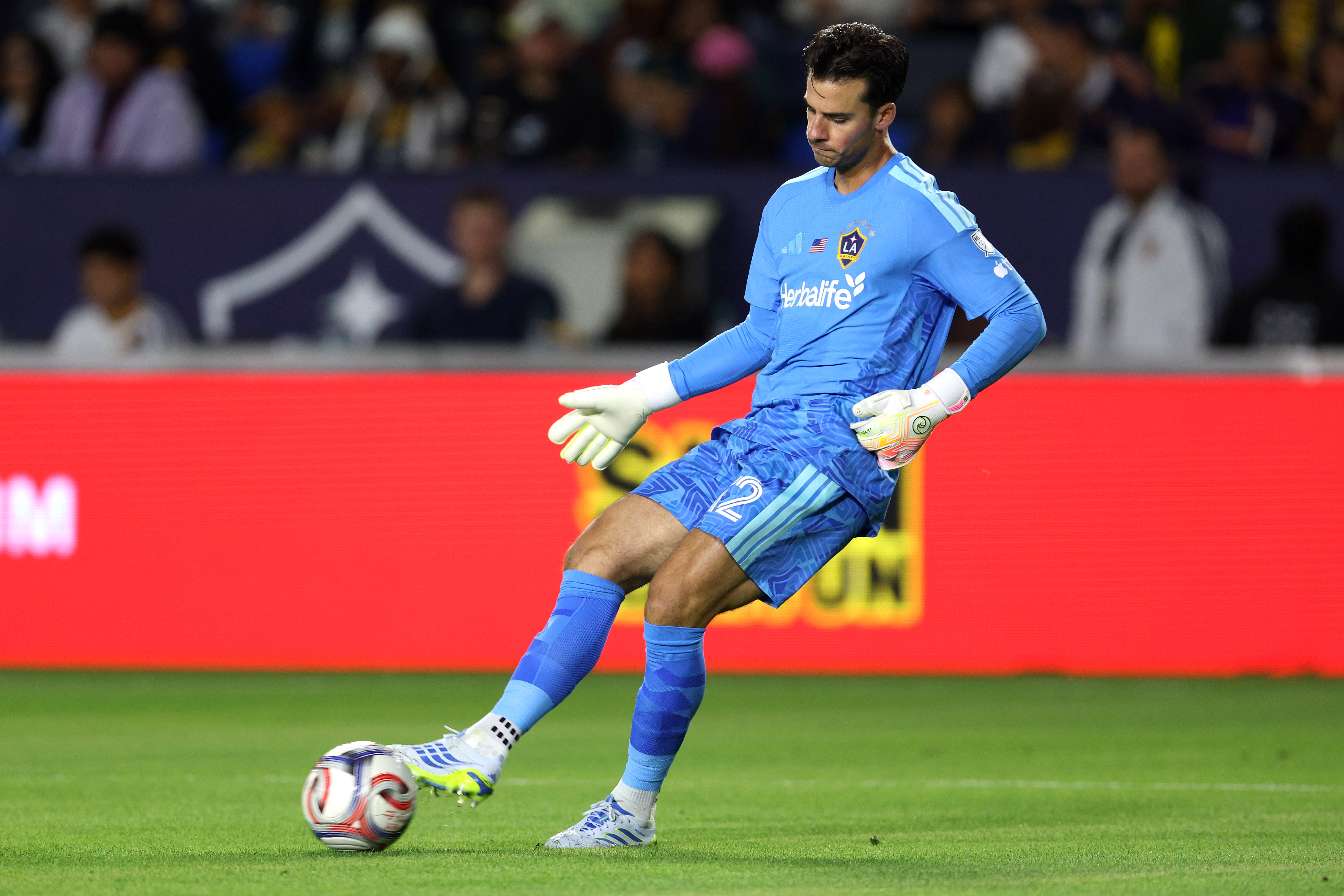 Galaxy goalkeeper JT Marcinkowski kicks the ball against the Houston...