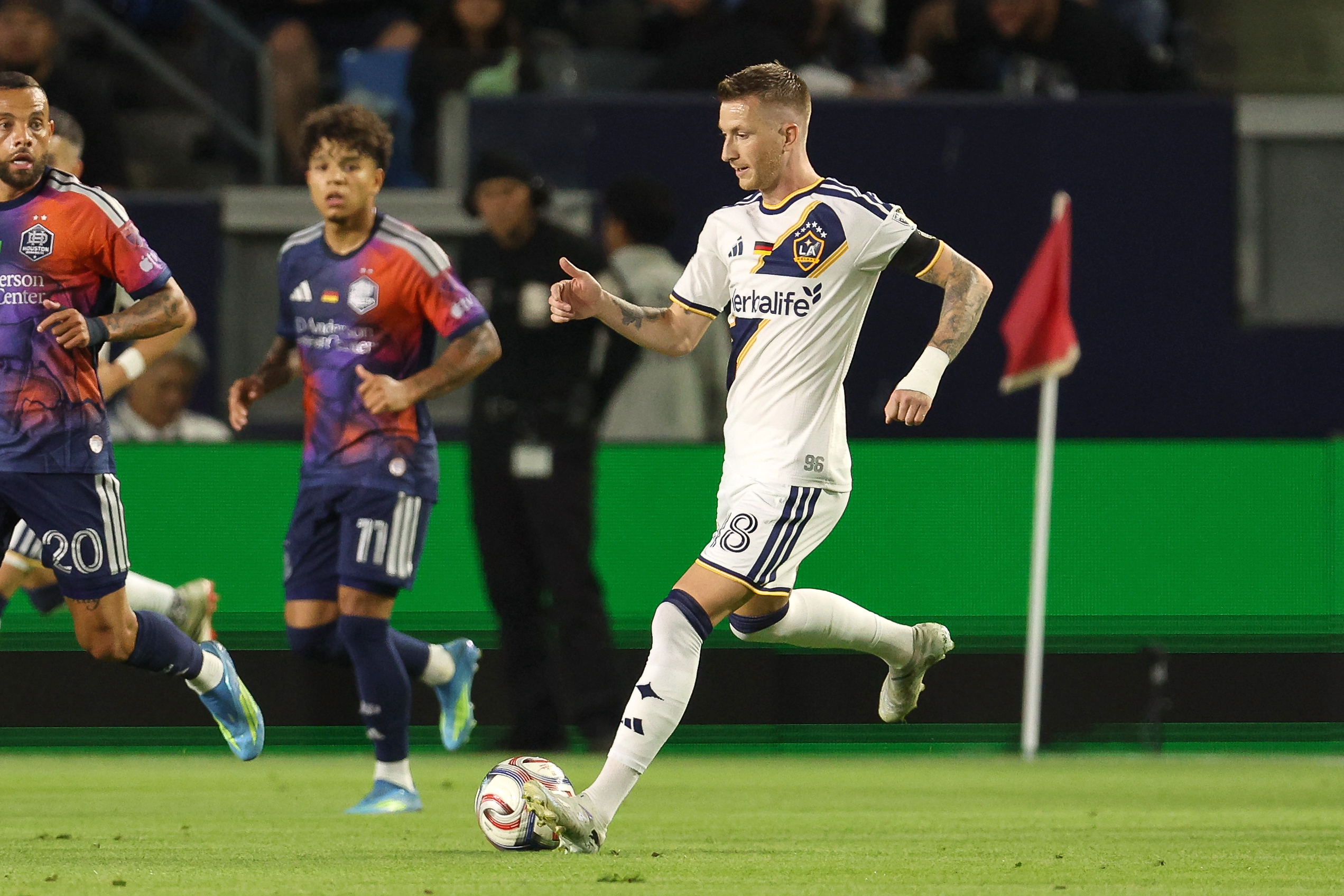 Galaxy midfielder Marco Reus (18) controls the ball against the...