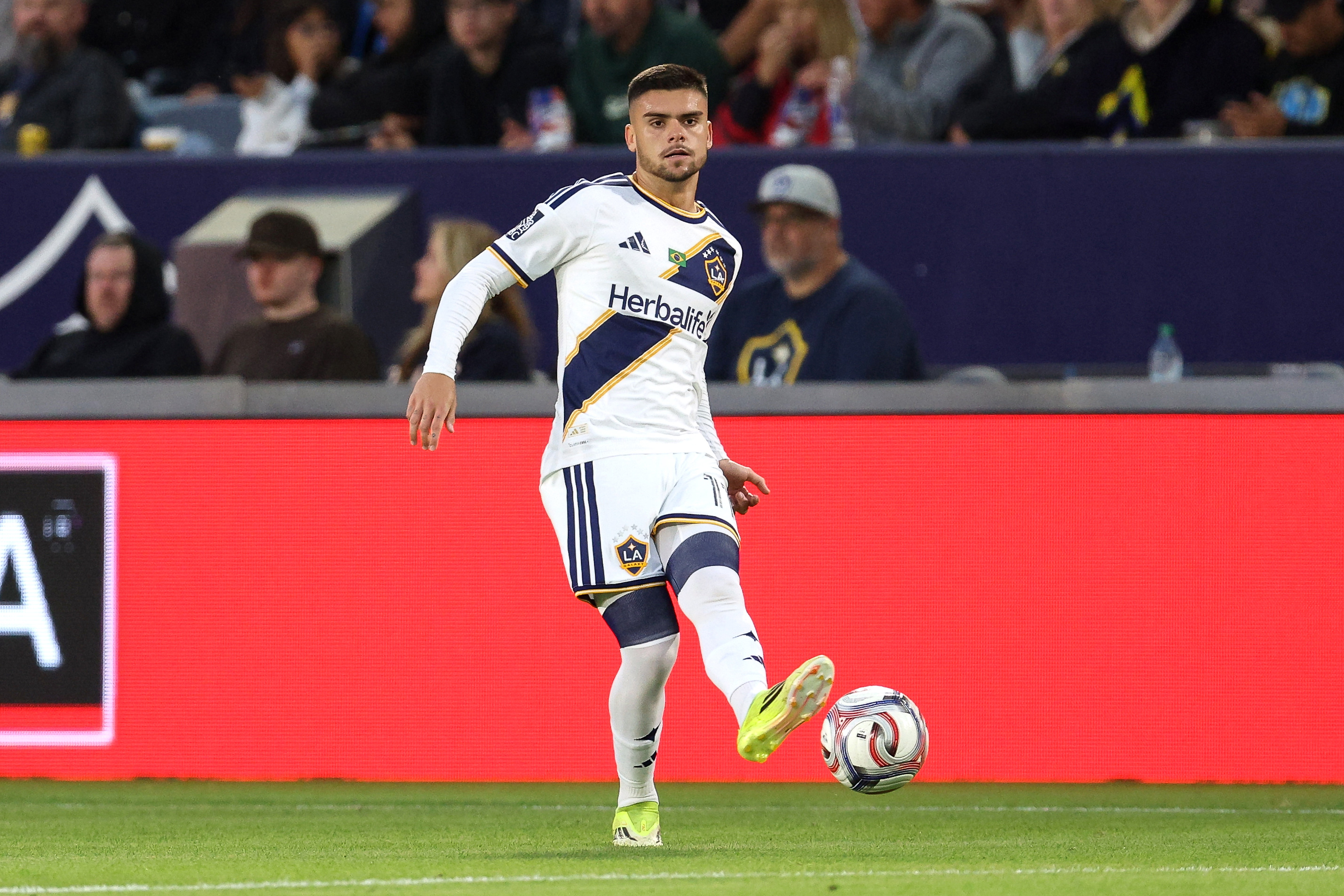 Galaxy forward Gabriel Pec kicks the ball against the Houston...