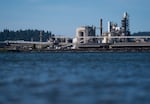 Nippon Dynawave Packaging Co. seen across the Columbia River on May 27, 2026. The river is now contaminated after the plant’s chemical disaster.