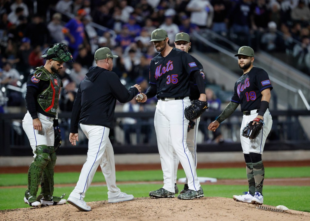 New York Mets pitcher Clay Holmes is taken out of the game by New York Mets manager Carlos Mendoza (C-L) against the New York Yankees during the fifth inning during the Subway Series at Citi field in the Queens, New York, USA, Friday, May 15, 2026.