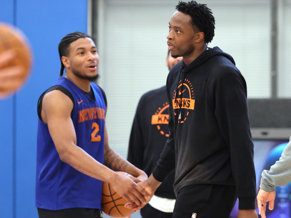 OG Anunoby slaps hands with Miles McBride during Knicks' practice on May 13, 2026 at the team's training facility in Tarrytown, N.Y.