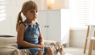 Orphanage Concept Sad Lonely Little Girl Sitting Bed