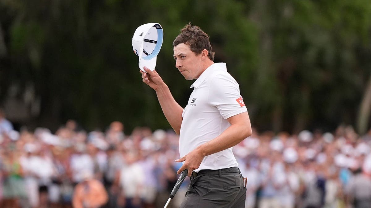 Matt Fitzpatrick waves his hat after winning the RBC Heritage