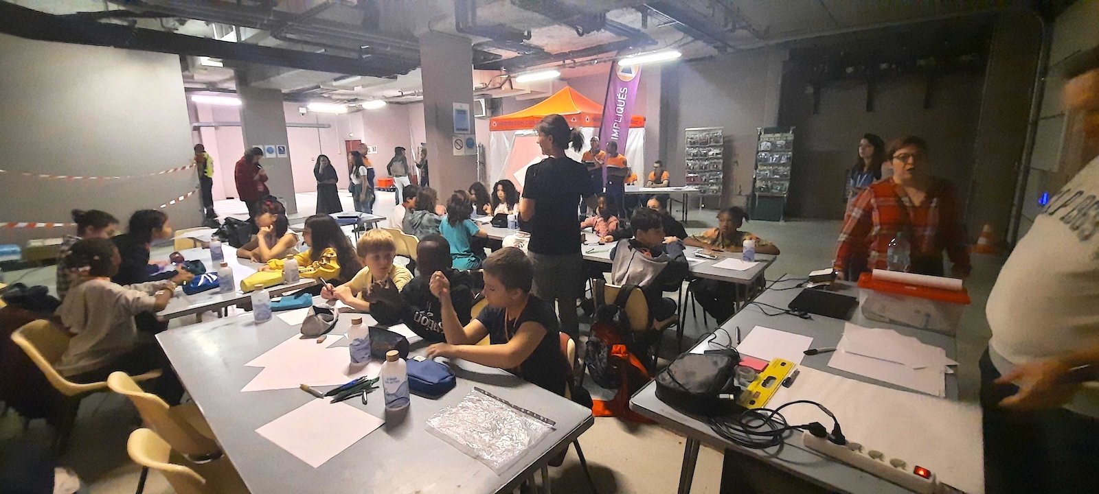 Young children and their teachers participate in an extreme heat simulation.