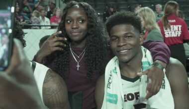Raven Johnson (left) and Anthony Edwards (right) take photos after one of his games at the University of Georgia in 2019.