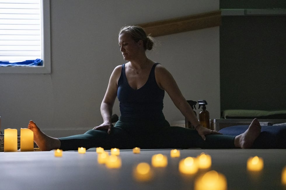 Kate Geiger, a former special education teacher, teaches a yoga class at Lotus House of Yoga.