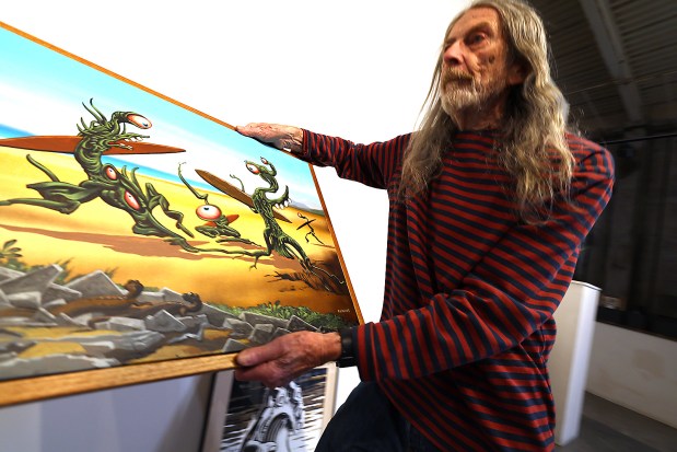 Jim Phillips hung his show at the R. Blitzer Gallery last week. (Shmuel Thaler Santa Cruz Sentinel)