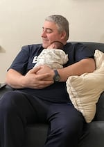 Gilbert Bernal poses with his grandchild in an undated photo provided by his family. Bernal is among the fatalities at the chemical explosion at Nippon Dynawave Packaging Co., in Longview on May 26, 2026.