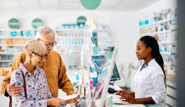 Senior couple buying prescription medicine in drugstore