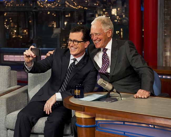 LATE SHOW WITH DAVID LETTERMAN, (from left): Stephen Colbert, host David Letterman, (Season 22, aired April 22, 2015). photo: Jeffrey R. Staab / ©CBS / courtesy Everett Collection