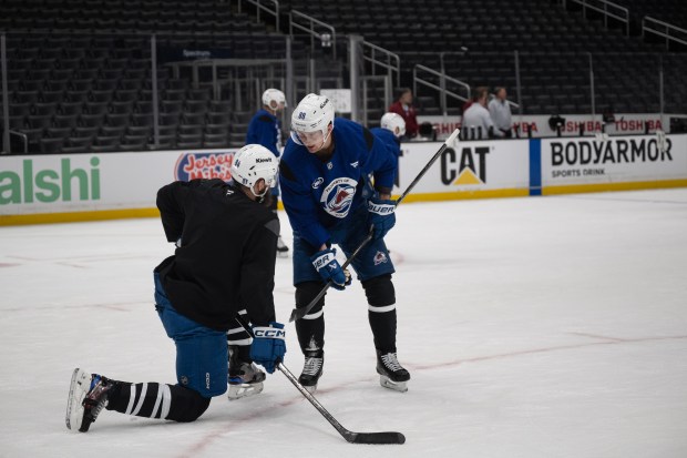 Defenseman Brent Burns (84) and center Martin Necas (88) of the Colorado Avalanche talks between drill during a practice on Saturday, April 25, 2026, at Crypto.com Arena in Los Angeles, Calif. (Photo by Timothy Hurst/The Denver Post)
