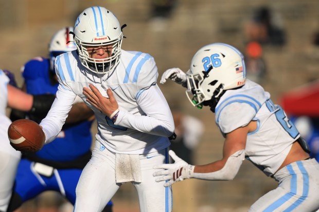 Valor's Titus Huard (8) passes the ball to Valor's Chase Hanosh (26) during the 5A semifinal football game that resulted in a 21-13 win for Cherry Creek at Stutler Bowl in Greenwood, Colo., on Saturday, Nov. 29, 2025.  (Photo by McKenzie Lange/Special to The Denver Post)