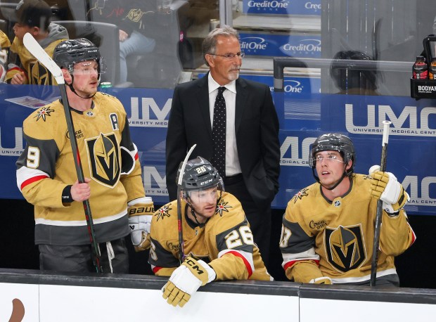 Head coach John Tortorella handles bench duties during his first game with the Vegas Golden Knights behind Jack Eichel #9, Nic Dowd #26 and Mitch Marner #93 in the first period of the team's game against the Vancouver Canucks at T-Mobile Arena on March 30, 2026 in Las Vegas, Nevada. (Photo by Ethan Miller/Getty Images)