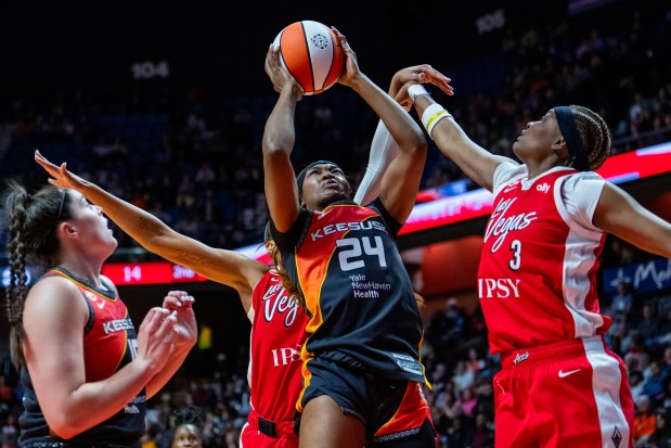 Aneesah Morrow #24 of the Connecticut Sun gets the rebound against NaLyssa Smith #3 of the Las Vegas Aces during the first half of a WNBA basketball game at Mohegan Sun Arena on May 15, 2026 in Uncasville, Connecticut. NOTE TO USER: User expressly acknowledges and agrees that, by downloading and or using this Photograph, user is consenting to the terms and conditions of the Getty Images License Agreement. (Photo by Joe Buglewicz/Getty Images)
