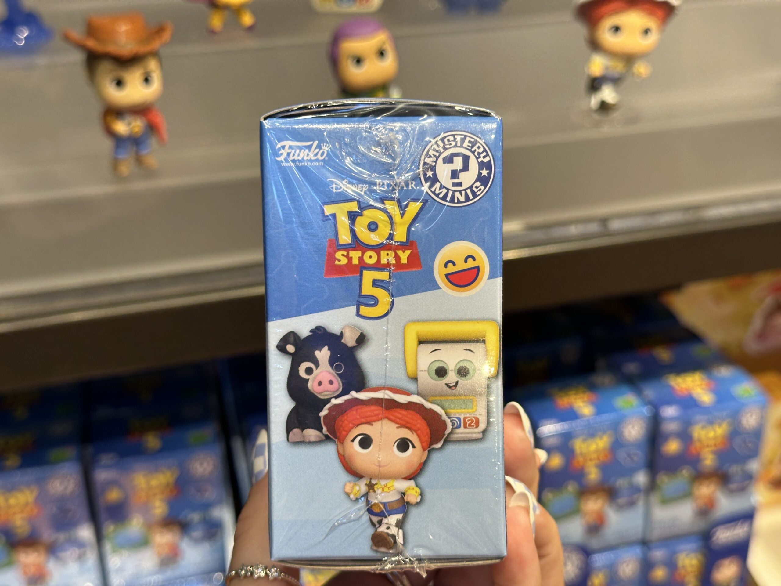 New mystery box collection featuring Toy Story 5 at Disney Springs