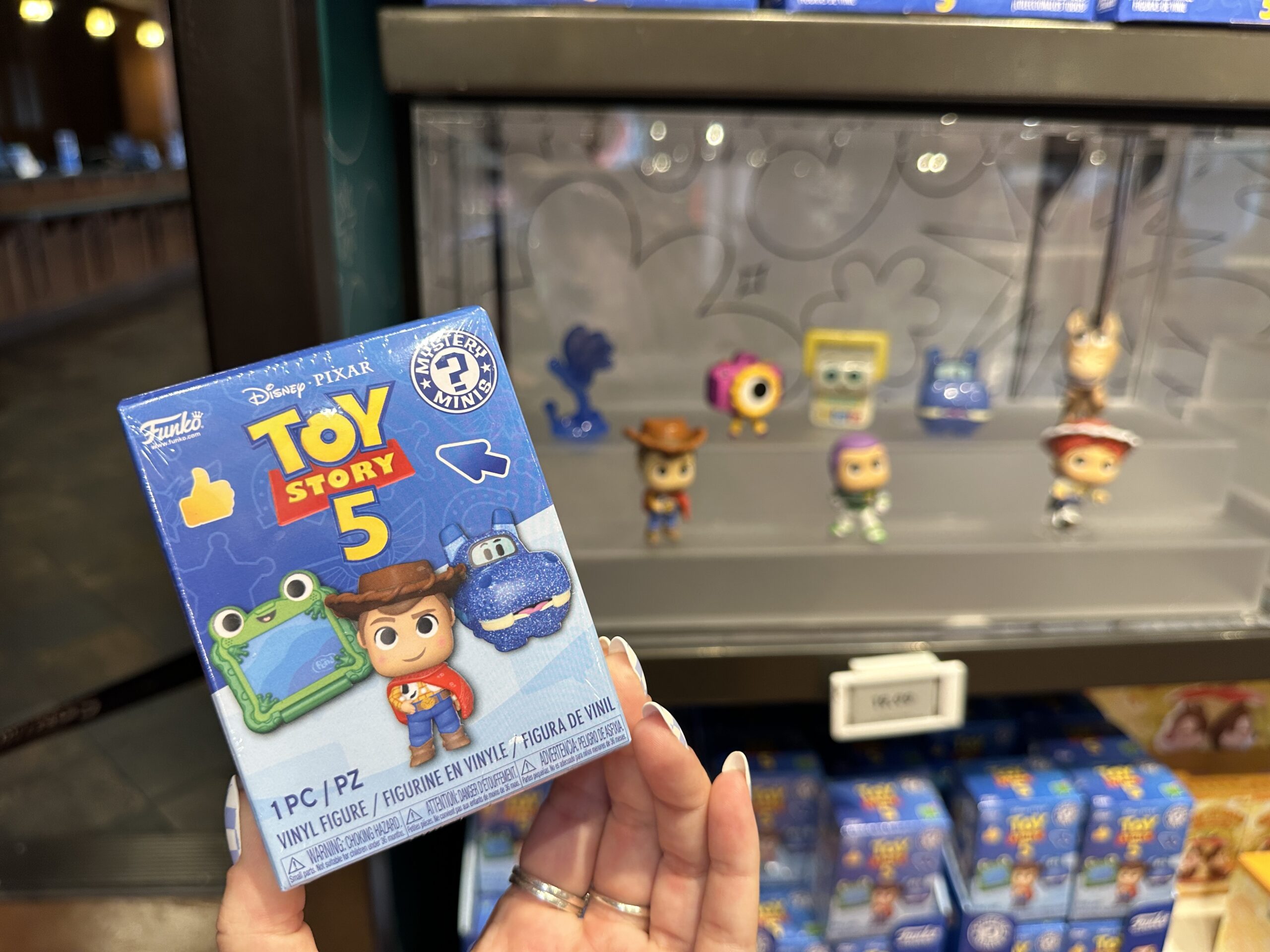 New mystery box collection featuring Toy Story 5 at Disney Springs