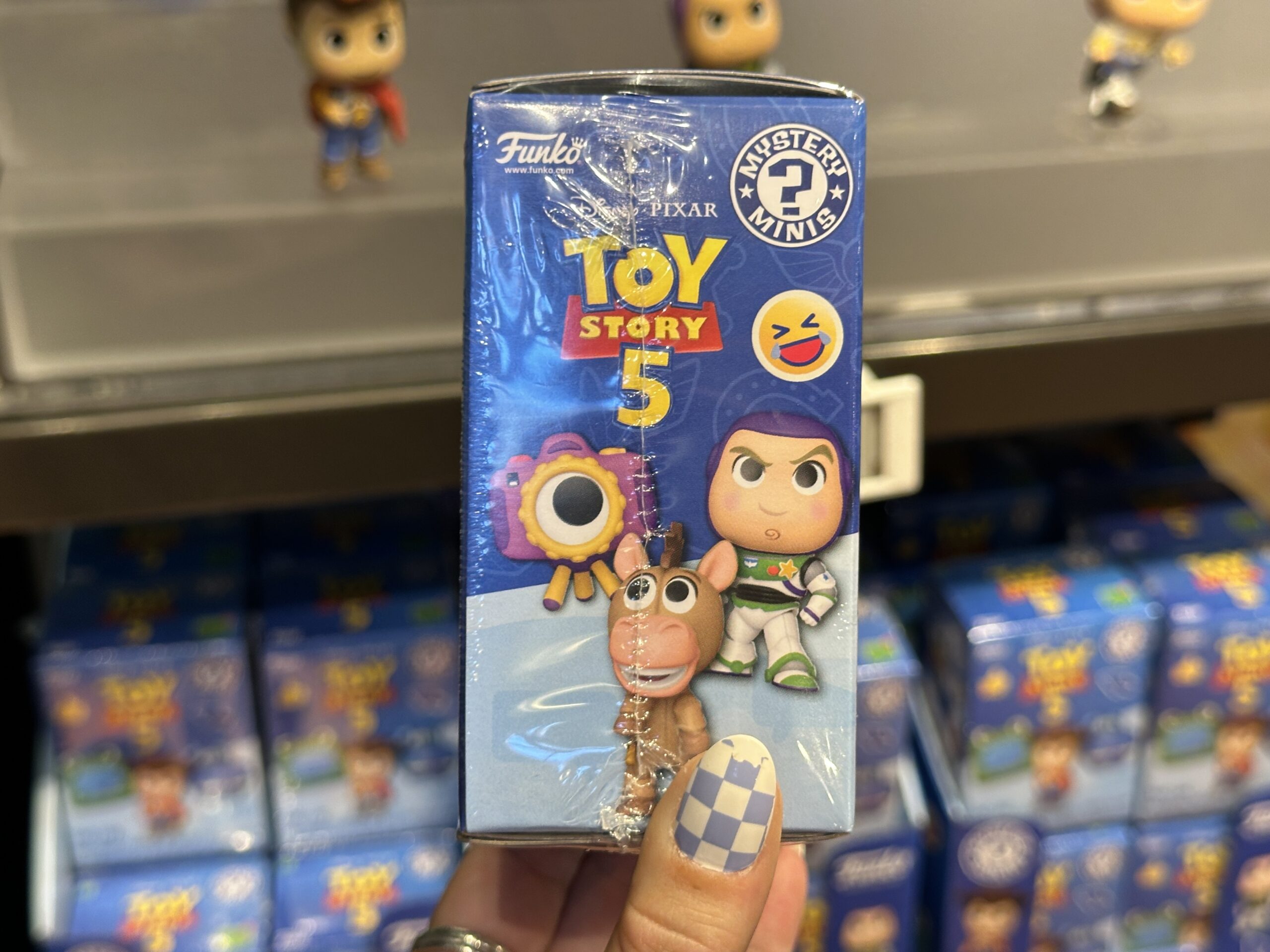 New mystery box collection featuring Toy Story 5 at Disney Springs