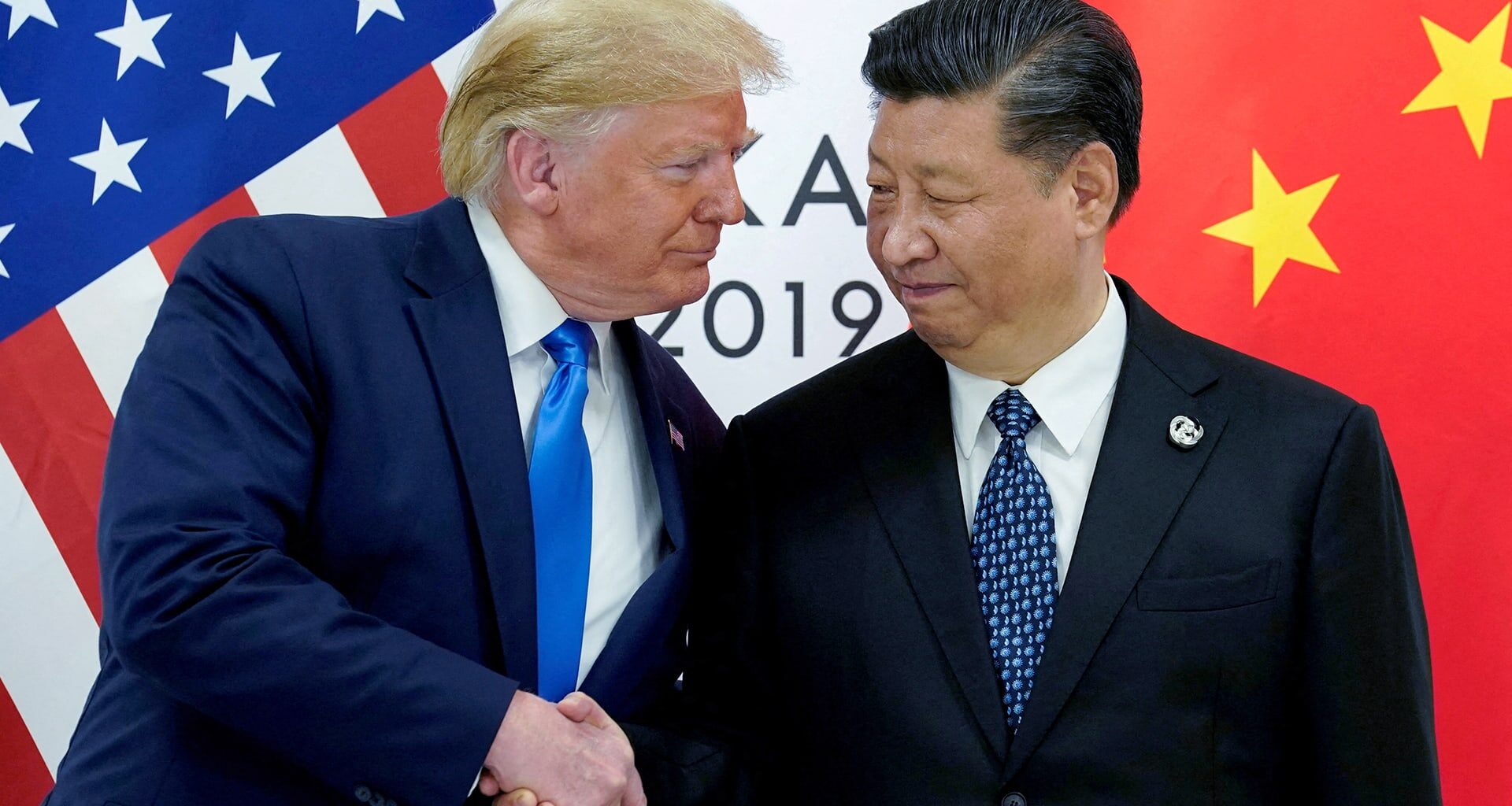 Chinese President Xi Jinping is seen greeting world leaders on a broadcast screen, as they meet during the APEC Economic Leaders' Week, in Gyeongju, South Korea, on November 1, 2025.