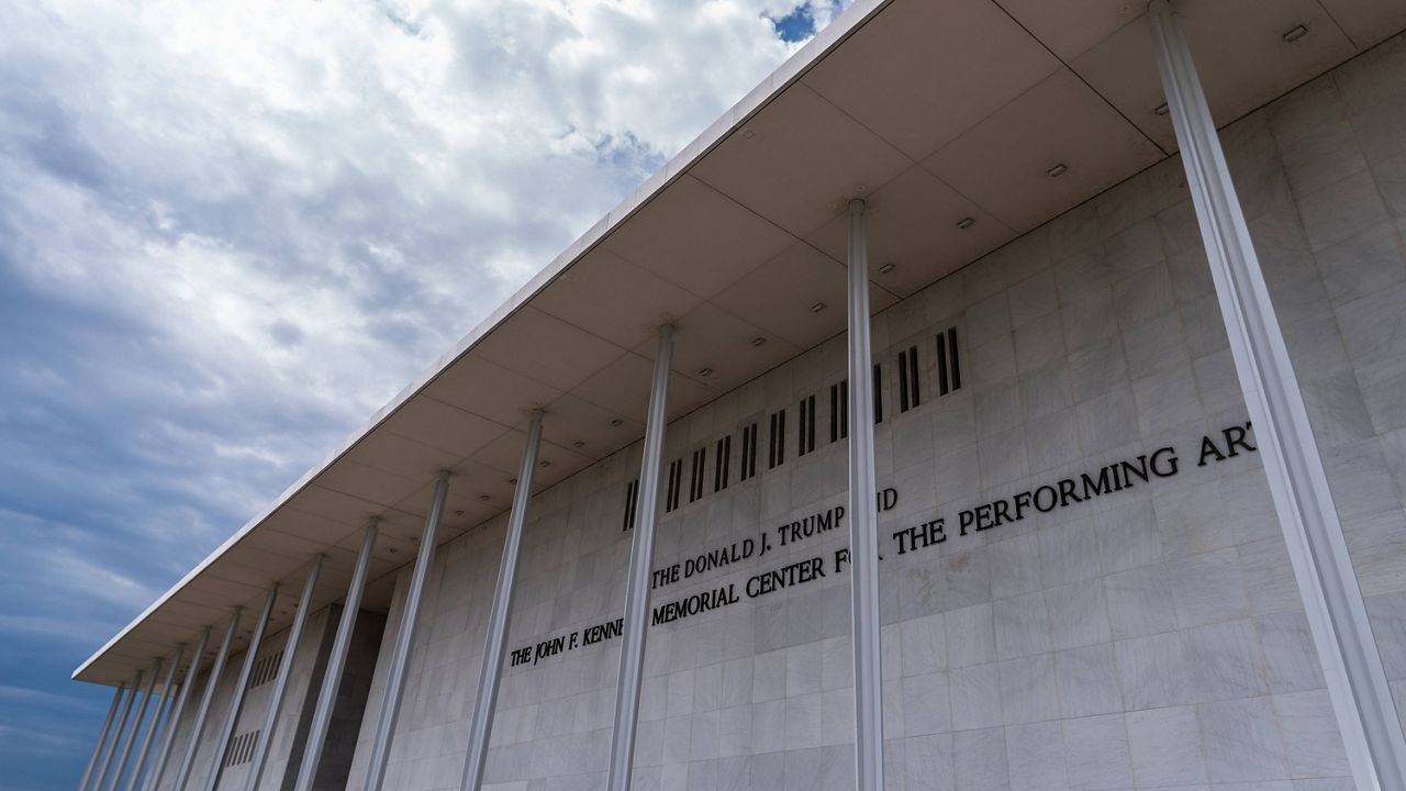 A woman walks outside The John F. Kennedy Memorial Center For The Performing Arts on Feb. 2, 2026, in Washington. (AP Photo/Rahmat Gul, File)