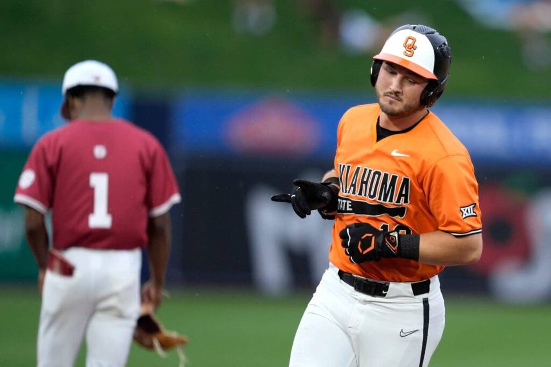 Oklahoma State's Kollin Ritchie rounds the bases after hitting a home run.