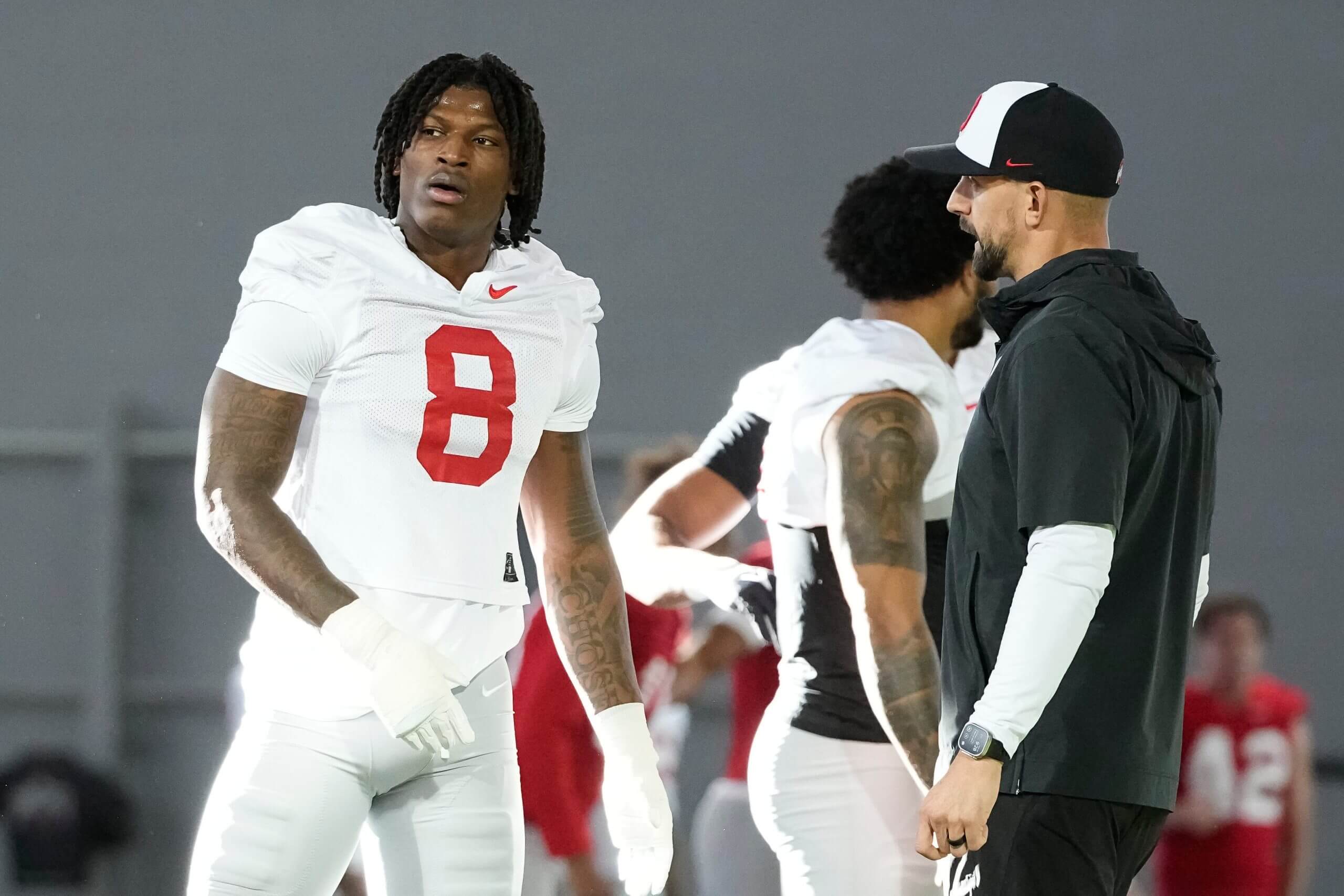 James Laurinaitis talks to Arvell Reese during practice.