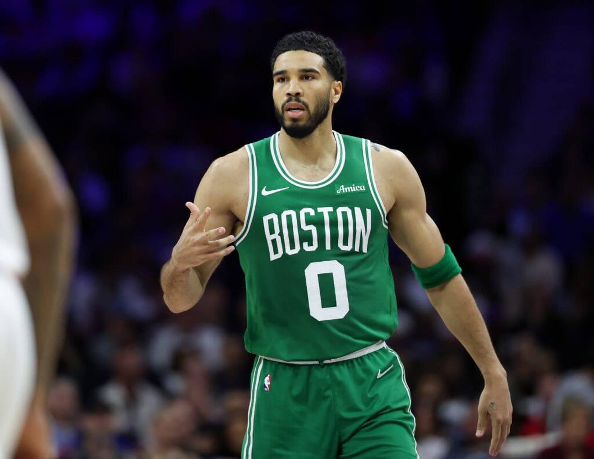 Celtics forward Jayson Tatum reacts to his score against the 76ers.