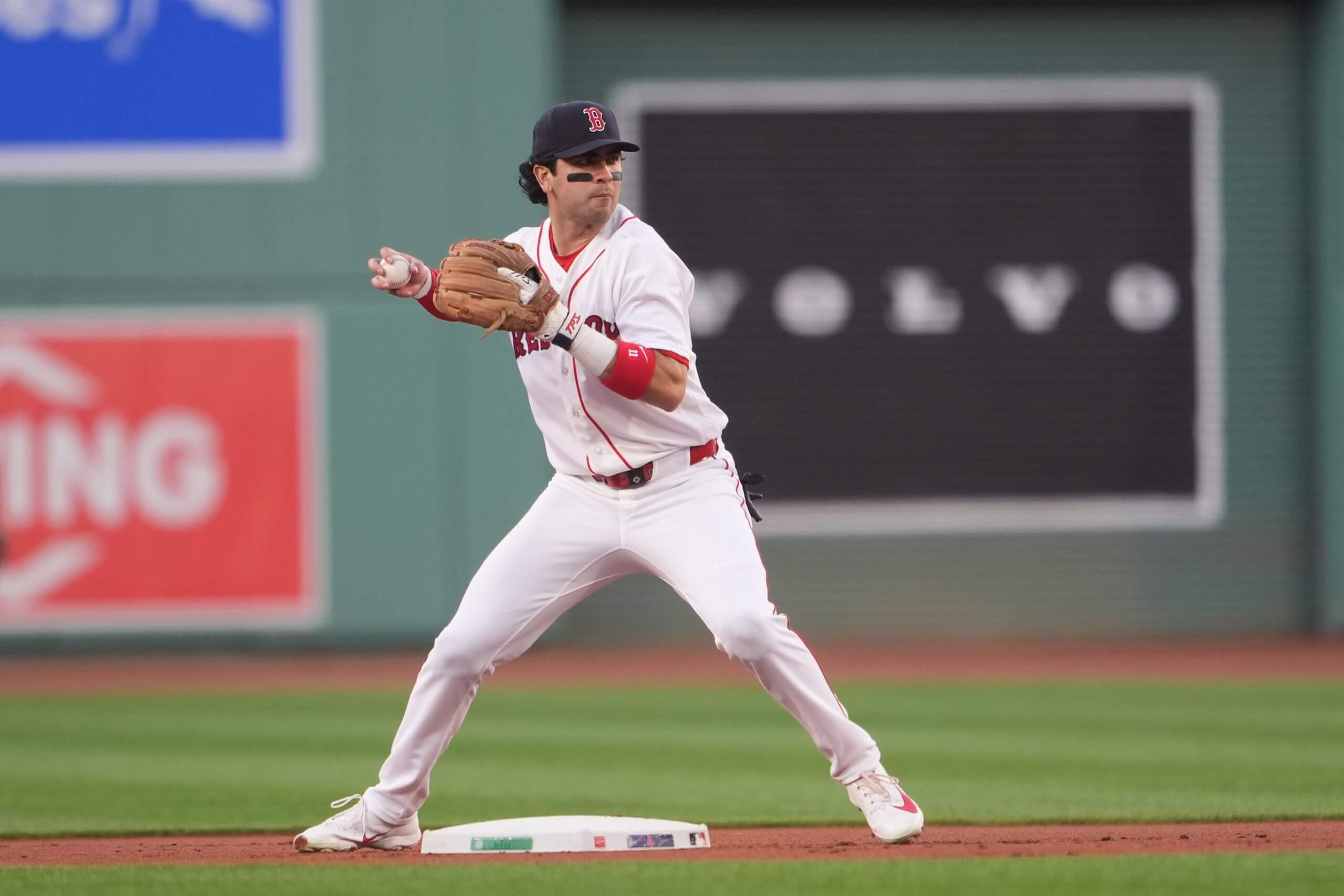 Marcelo Mayer, playing second base, turns a double play against the Tampa Bay Rays.