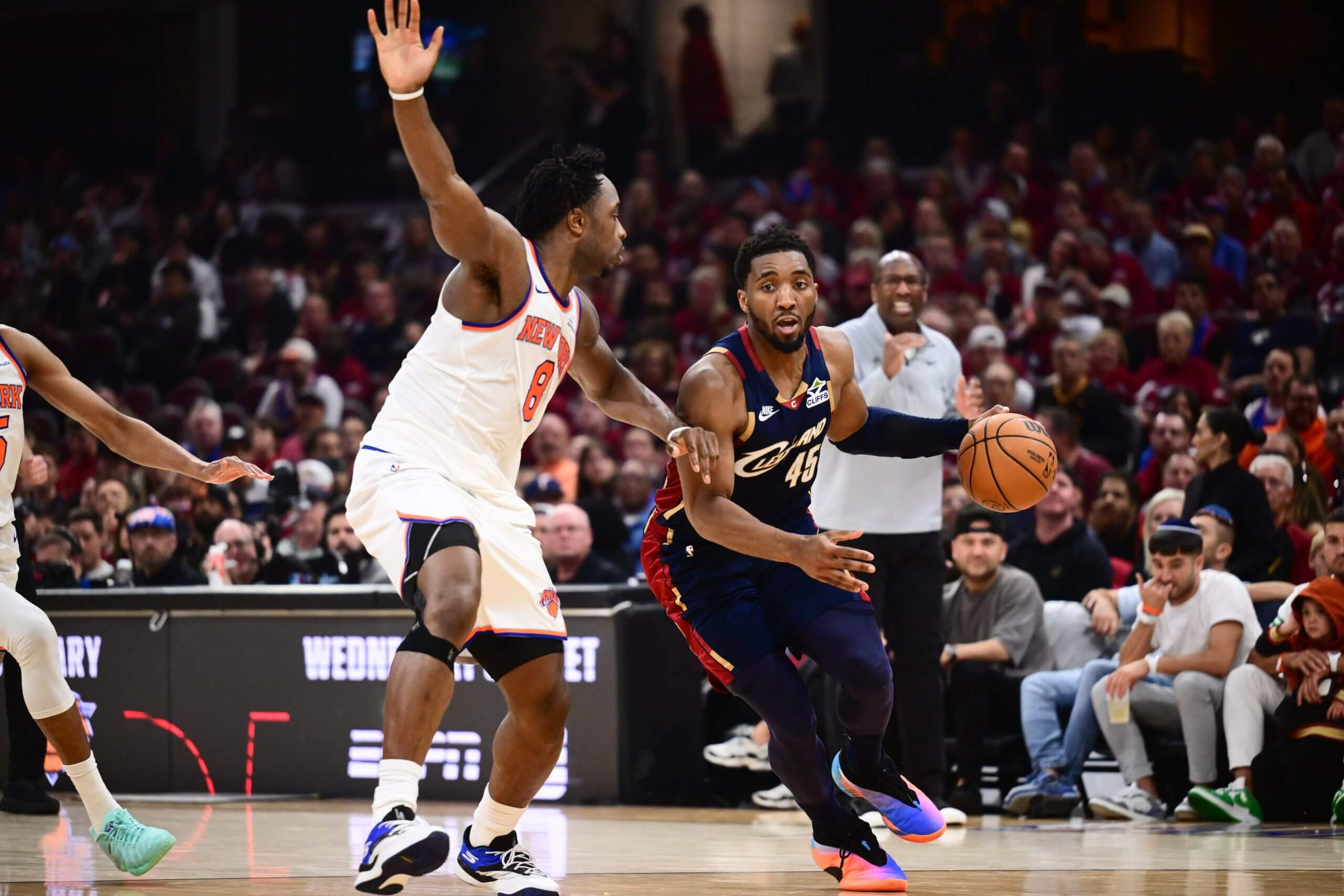 Cleveland Cavaliers guard Donovan Mitchell drives the ball while defended by New York Knicks forward OG Anunoby.