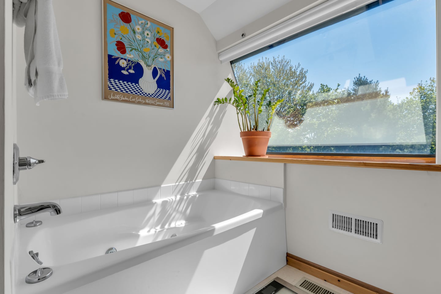 Natural light streams into the bathroom.