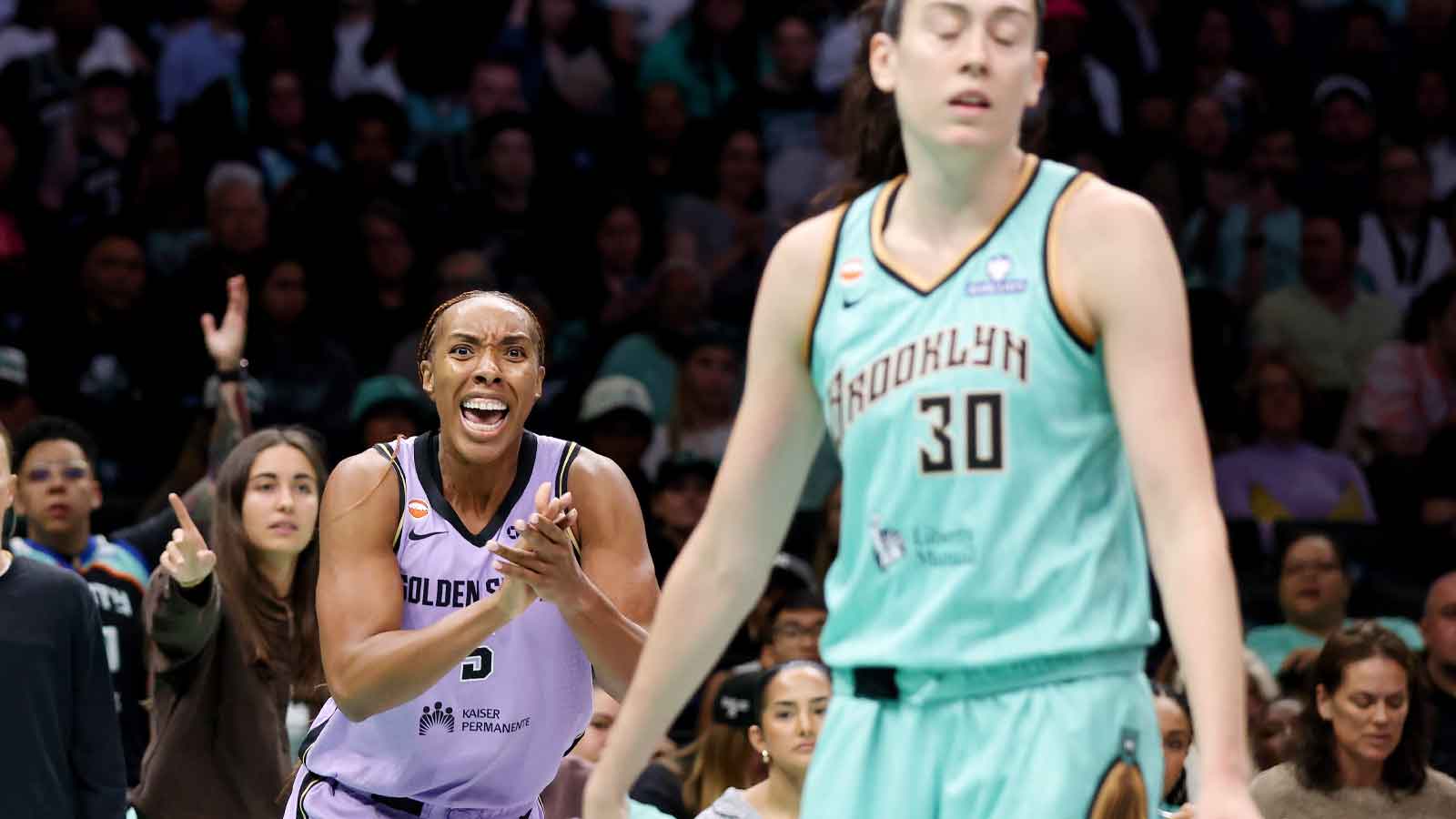 Golden State Valkyries forward Kayla Thornton (5) reacts after a basket against New York Liberty forward Breanna Stewart (30) during the second half at Barclays Center. 
