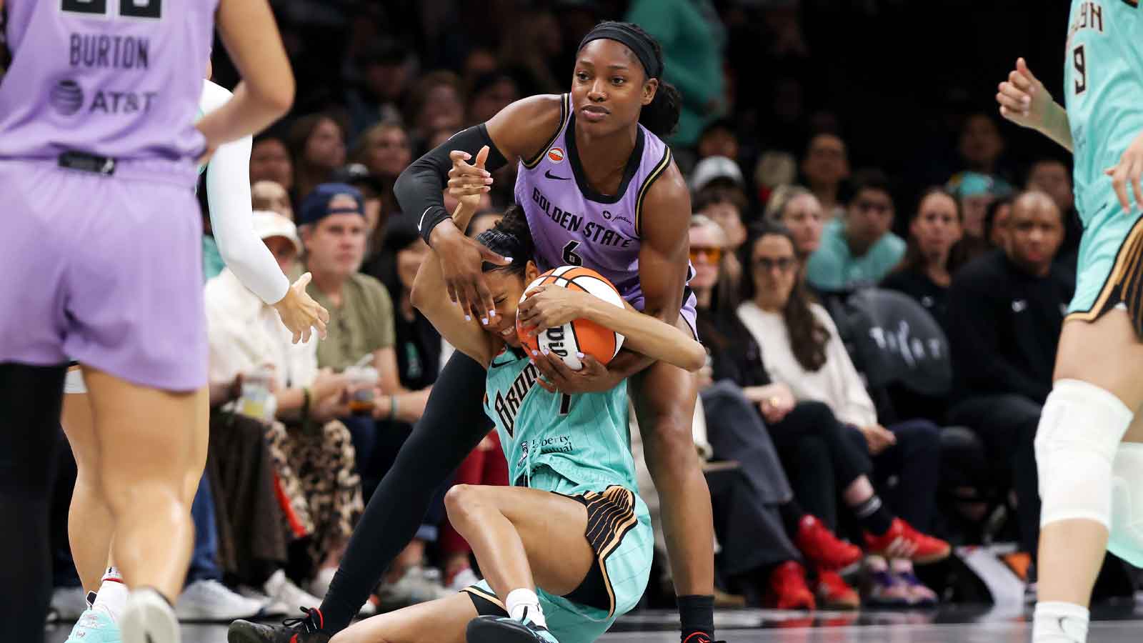 Golden State Valkyries guard-forward Kaila Charles (6) and New York Liberty guard Rebekah Gardner (7) fight for the ball during the second half at Barclays Center. 
