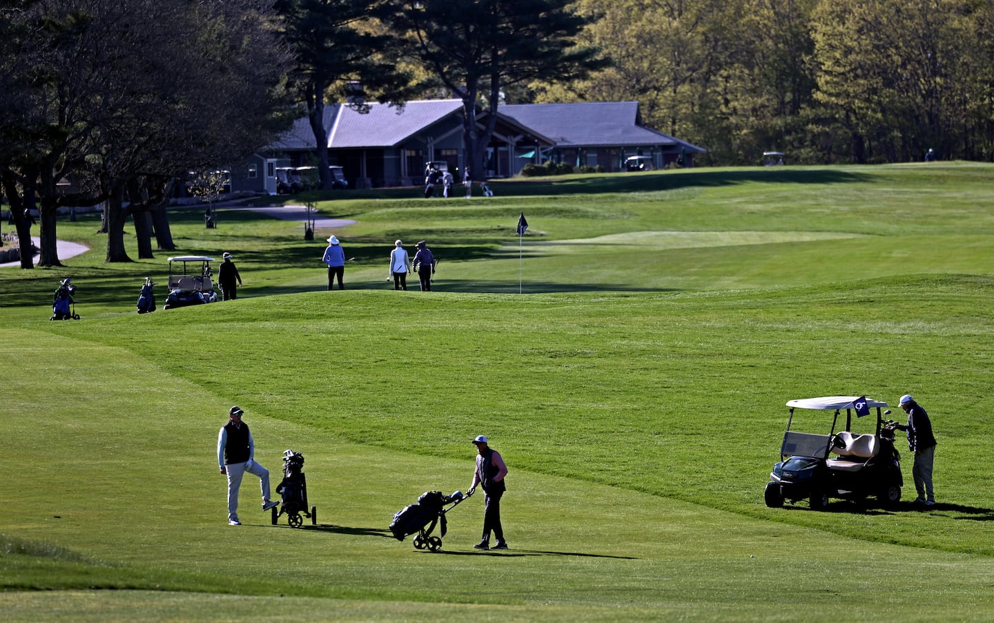 Golfers play the first fairway at the William J. Devine in Franklin Park.