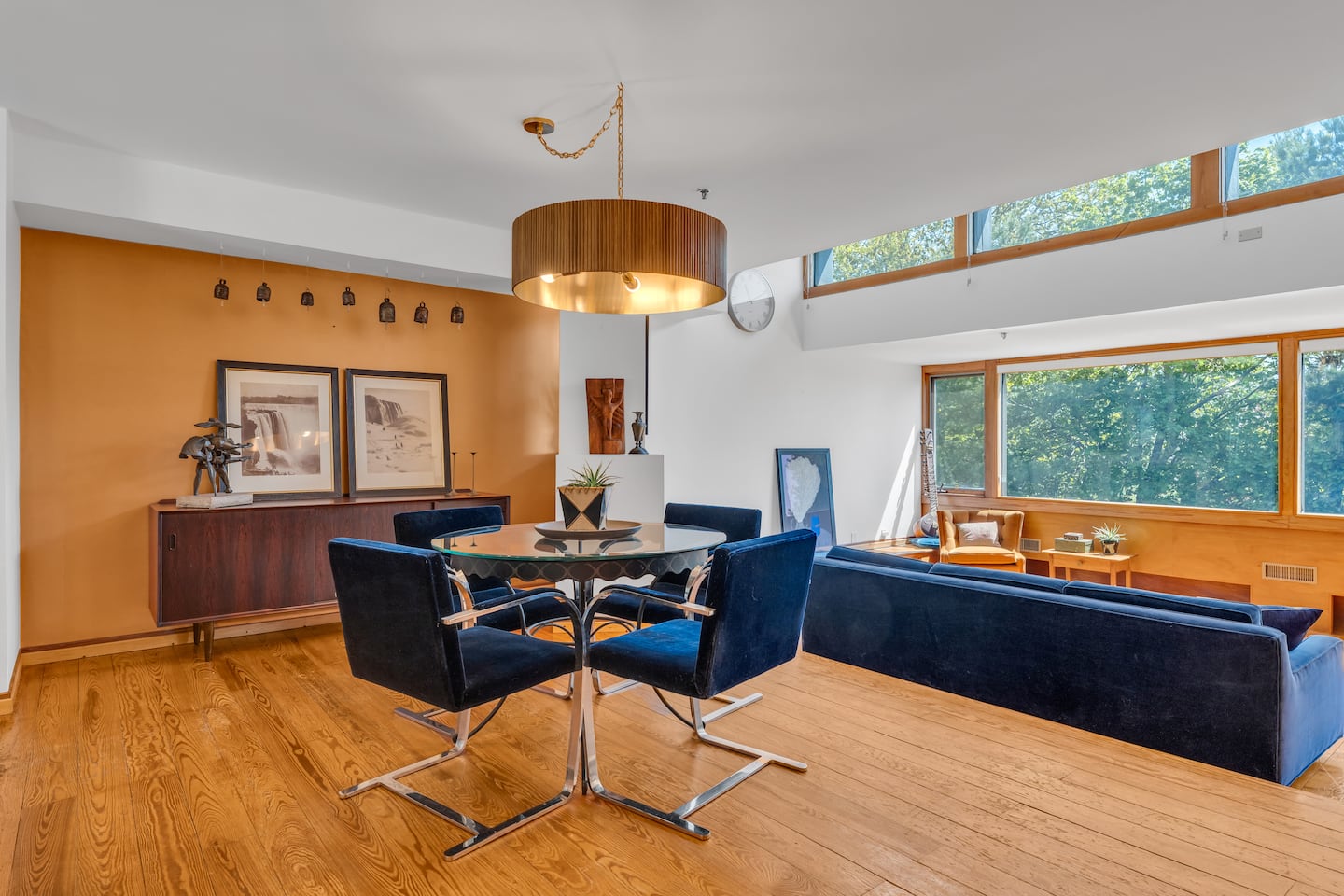 The dining room is elevated behind the living room.