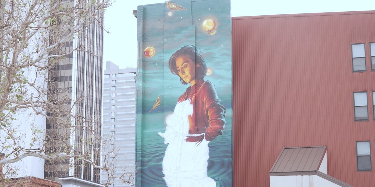 International artist duo brings three rivers-inspired mural to The Landing in Fort Wayne