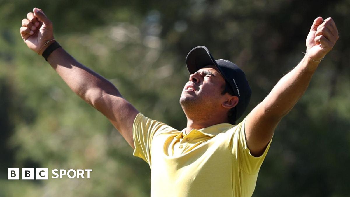 South Africa's Yurav Premlall holds his arms aloft in celebration