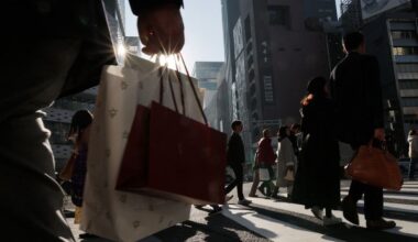 Japan keeps view economy recovering but warns risk from Middle East