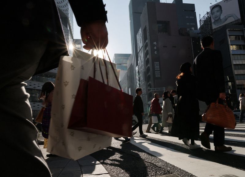 Japan keeps view economy recovering but warns risk from Middle East