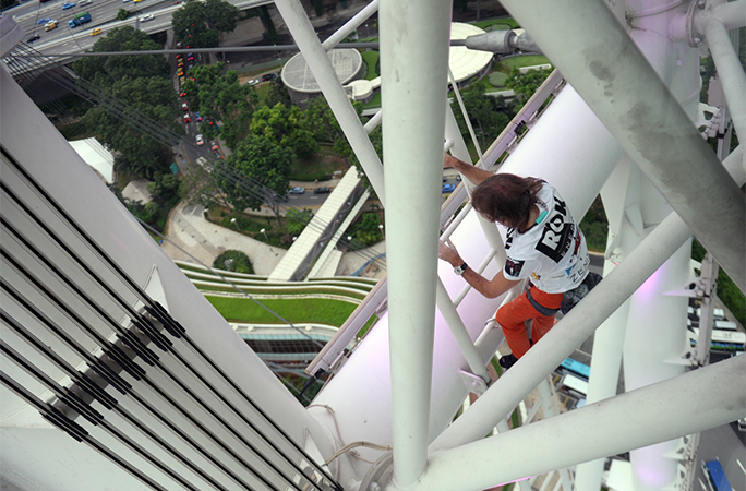 man climbing building