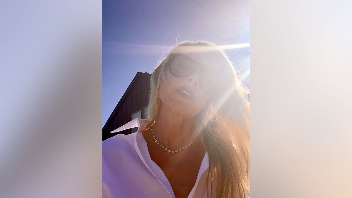 Ali Larter posing with the sun shining behind her in May 2026.