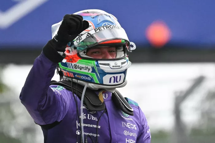 Andrea Kimi Antonelli celebrates after winning