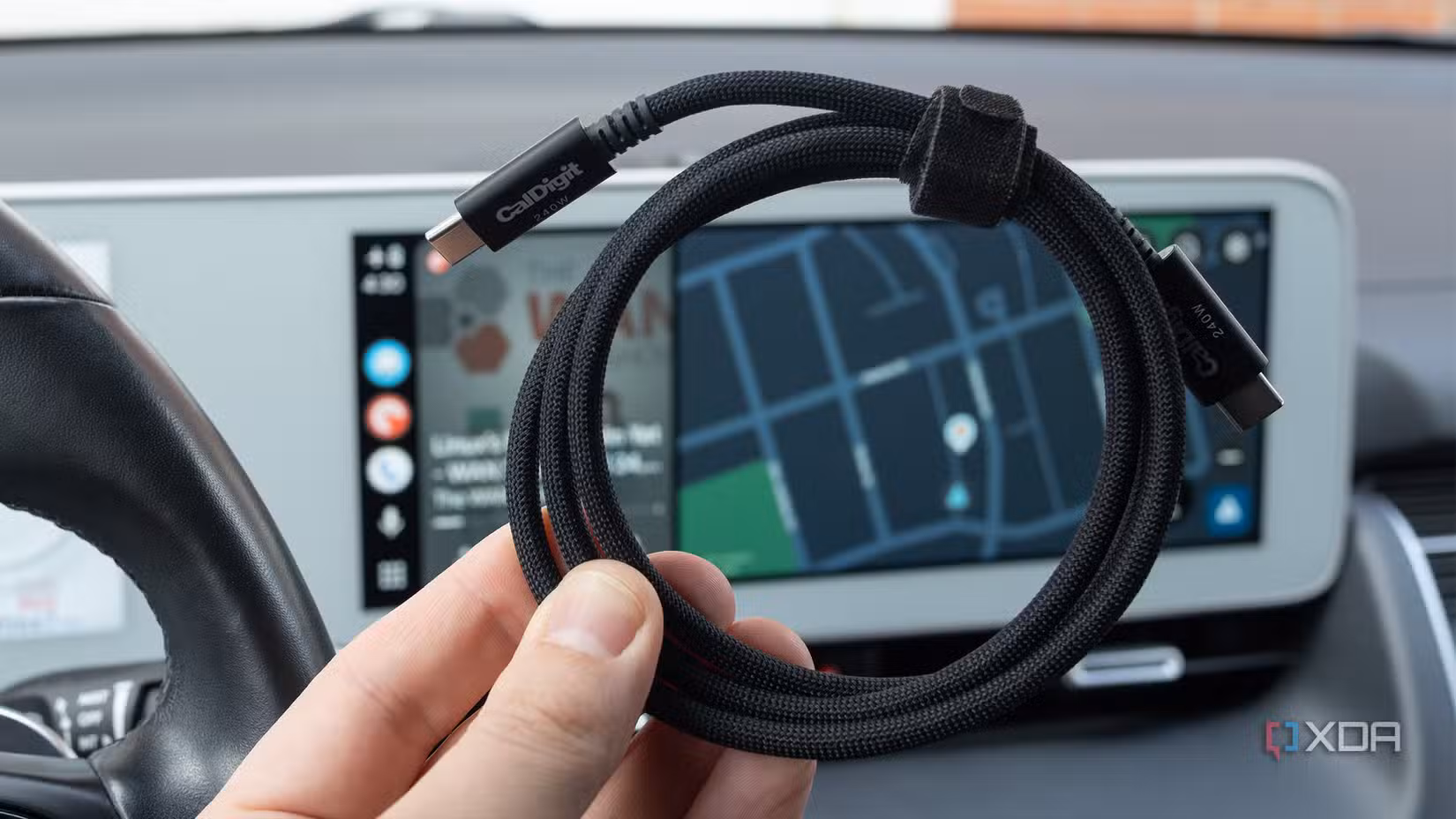 A Thunderbolt 5 cable in front of Android Auto