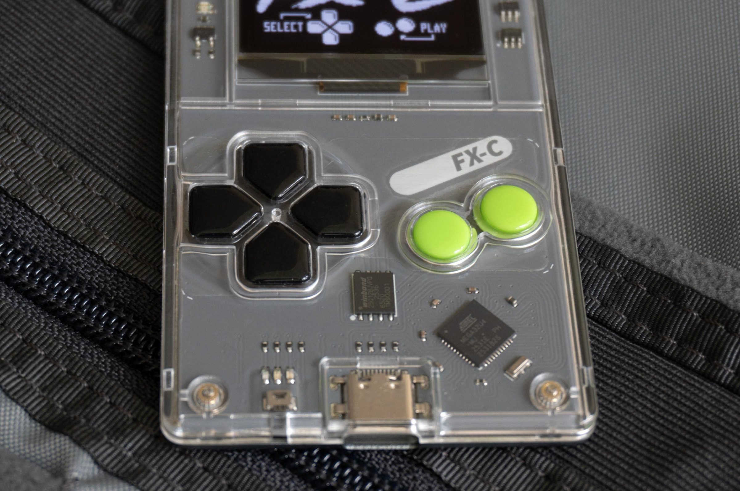 A close-up of the Arduboy FX-C’s buttons.
