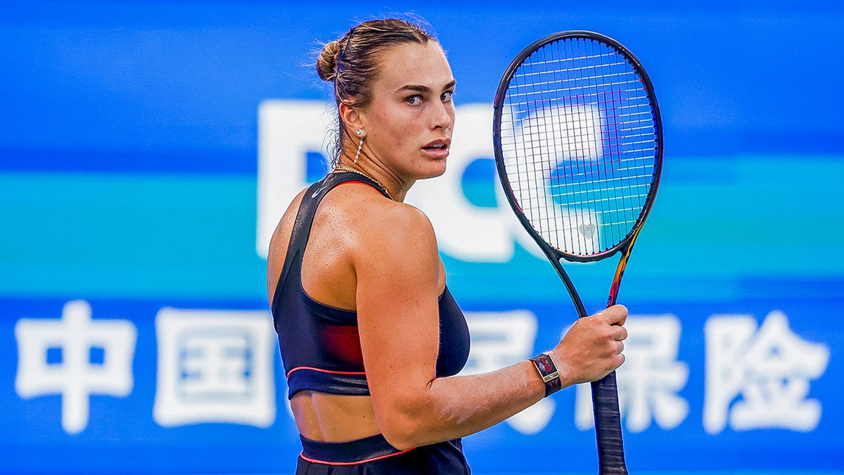 Aryna Sabalenka reacting on court during Wuhan Open tennis match