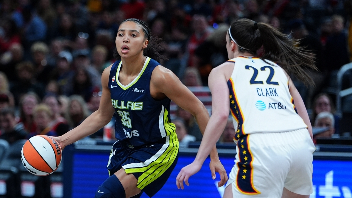 Dallas Wings guard Azzi Fudd (No. 35) drives to the basket against Indiana Fever guard Caitlin Clark (No. 22) during the 2026 preseason opener.