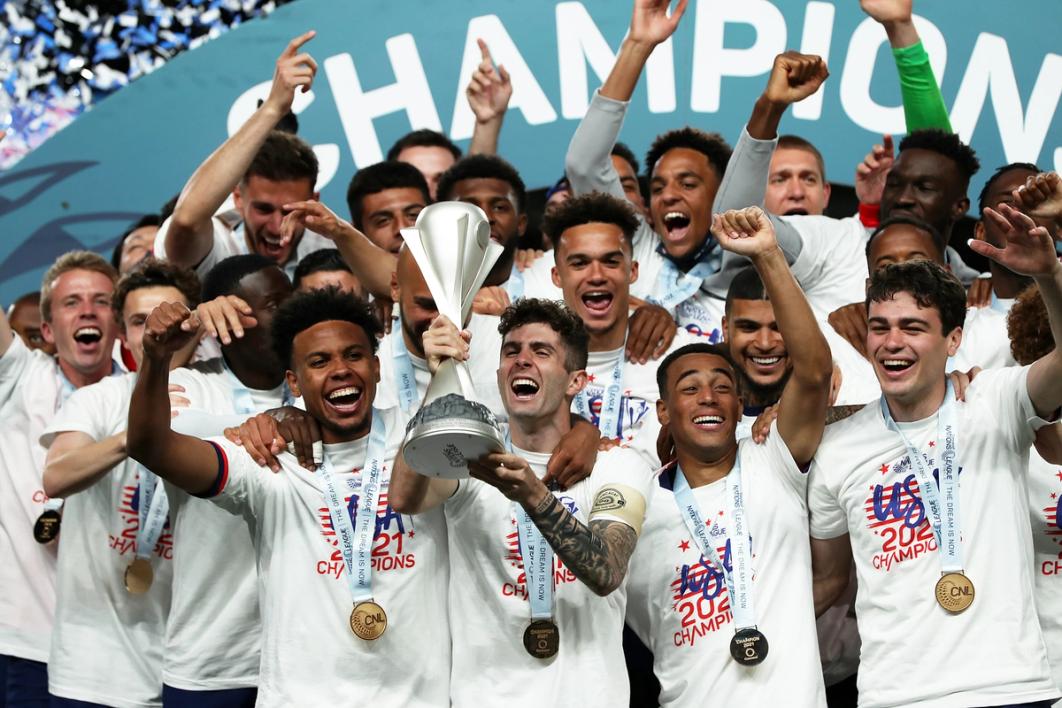 Christian Pulisic, Weston McKennie lift trophy after winning the Concacaf Nations League Final between United States and Mexico on June 6, 2021 in Denver, Colo. (Photo by Omar Vega/Getty Images)